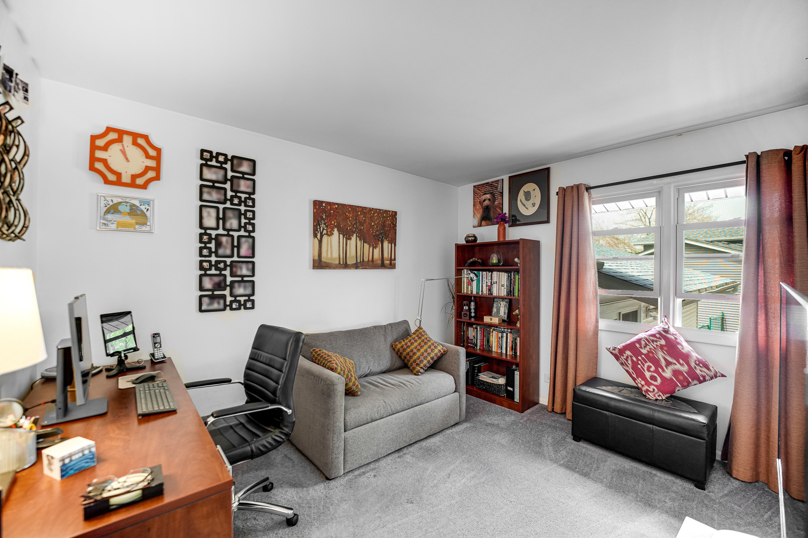 920 Harrison Lane Hoffman Estates, IL 60192 - Photo 14 of 26 a living room with furniture a bookshelf and a window