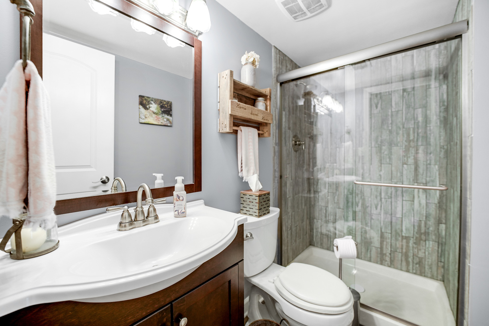 920 Harrison Lane Hoffman Estates, IL 60192 - Photo 18 of 26 a bathroom with a sink a toilet and shower