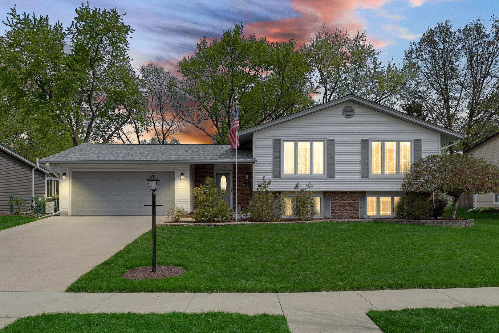 920 Harrison Lane Hoffman Estates, IL 60192 - Photo 2 of 26 a front view of a house with a yard