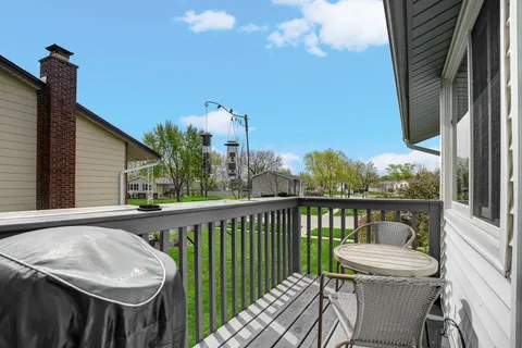 a view of a balcony with furniture