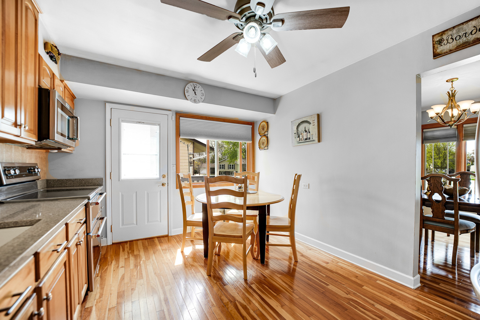 920 Harrison Lane Hoffman Estates, IL 60192 - Photo 9 of 26 a view of a dining room with furniture and a chandelier