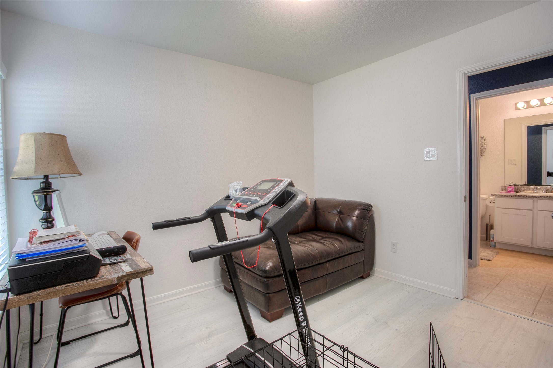 28617 Rantoul Court Point Blank, TX 77364 - Photo 21 of 29 a living room with furniture and a lamp