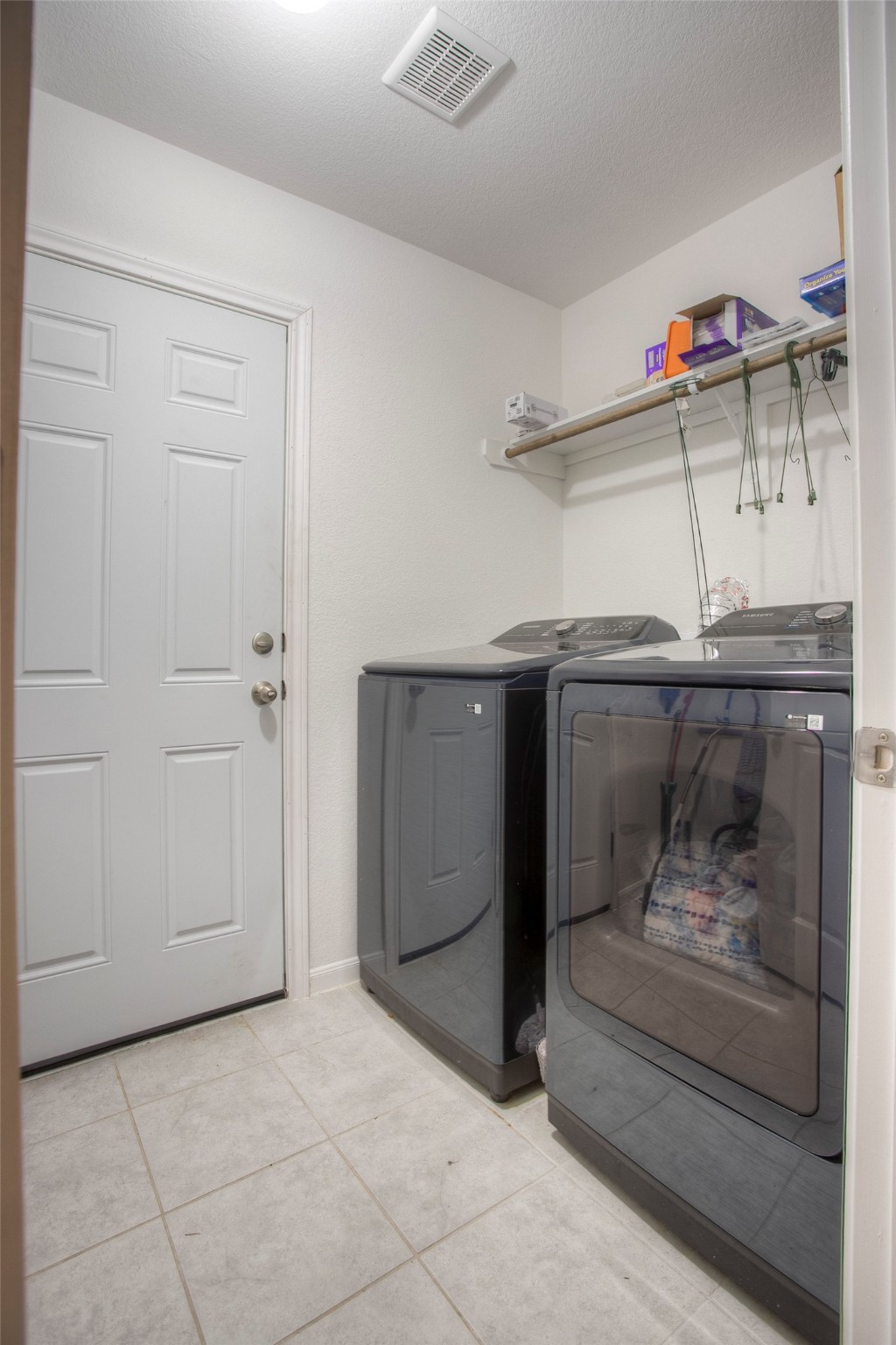 28617 Rantoul Court Point Blank, TX 77364 - Photo 24 of 29 a living room with furniture and a fireplace