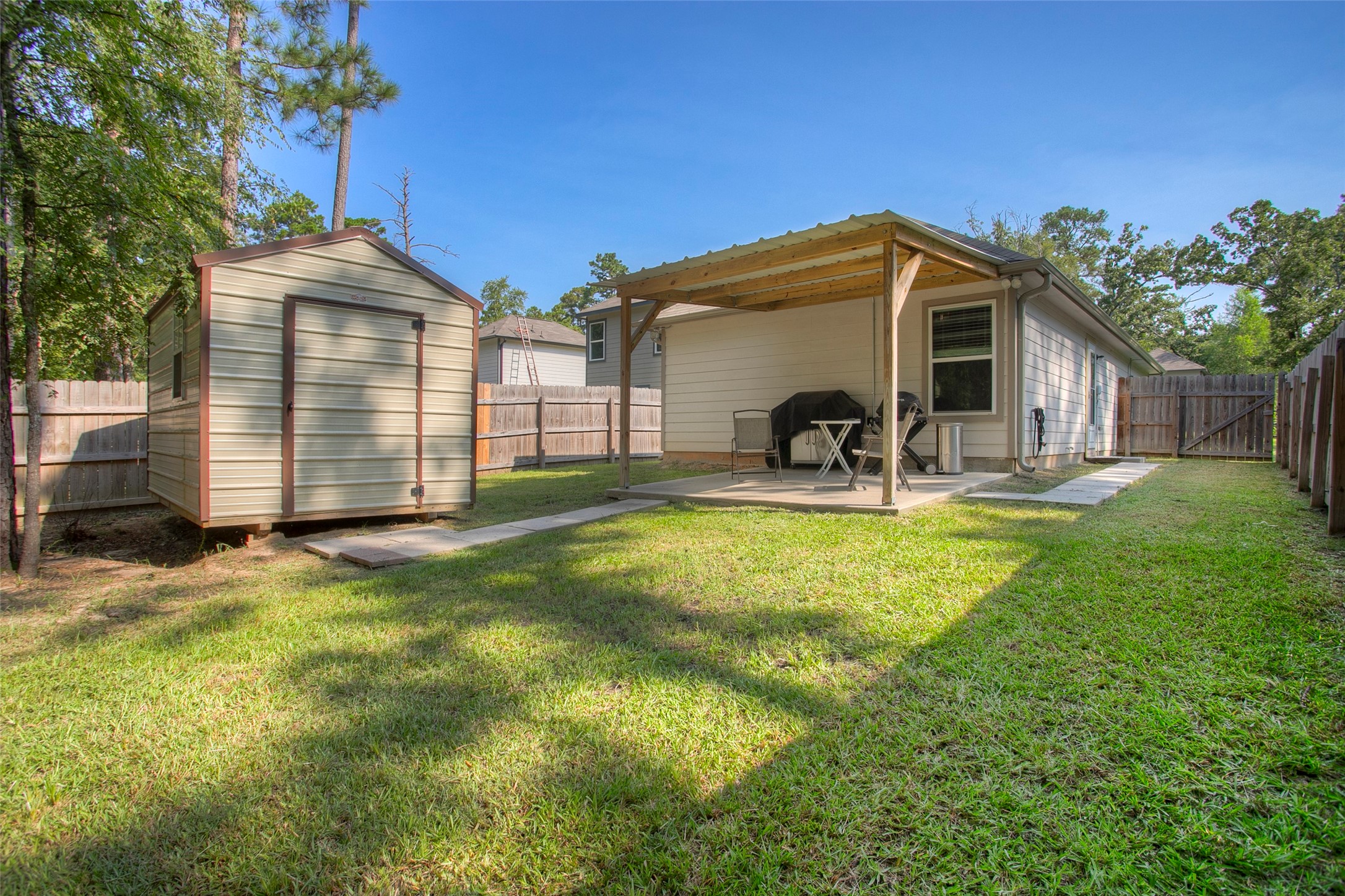 28617 Rantoul Court Point Blank, TX 77364 - Photo 26 of 29 a front view of a house with garden