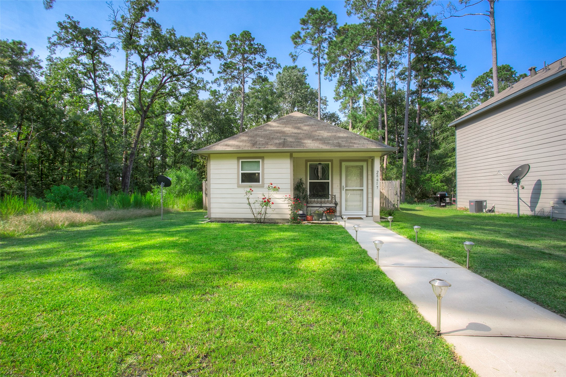 28617 Rantoul Court Point Blank, TX 77364 - Photo 4 of 29 a view of a yard in front of house