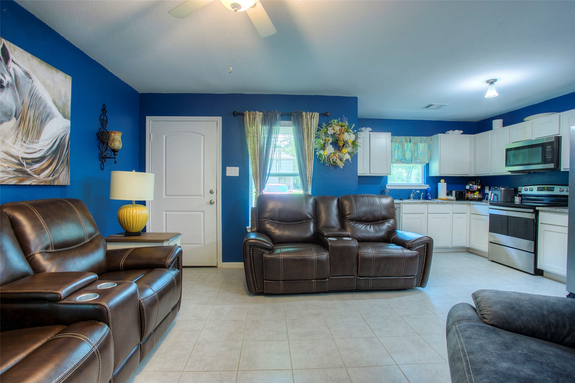 28617 Rantoul Court Point Blank, TX 77364 - Photo 9 of 29 a living room with furniture and a fireplace
