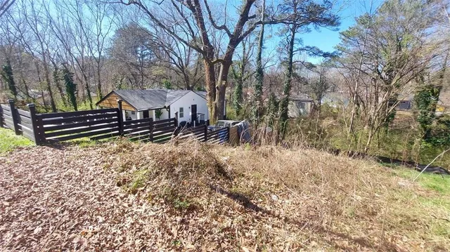 a wooden bench sitting in middle of forest