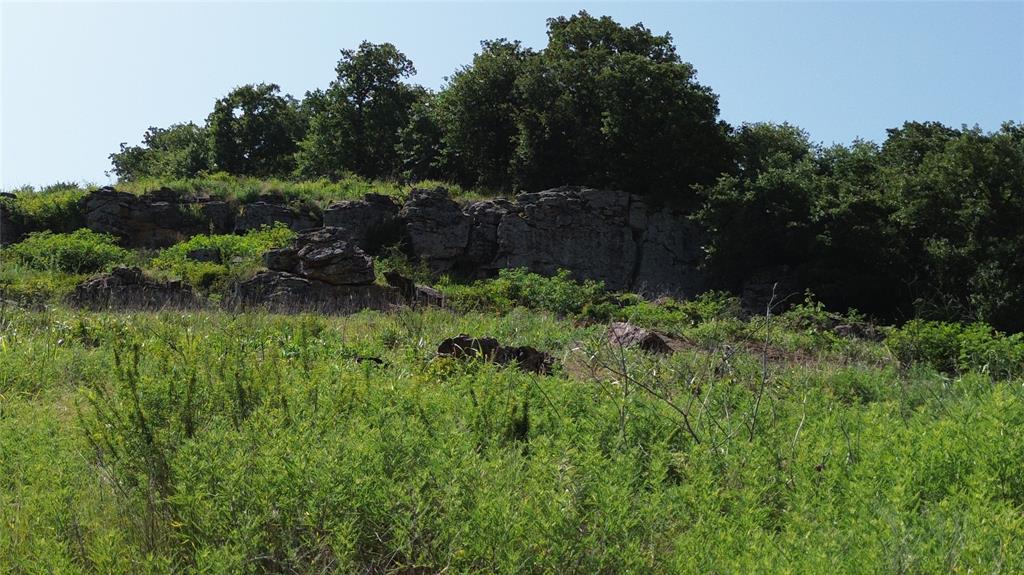 Tbd Nash Road Jacksboro, TX 76458 - Photo 24 of 28 Natural rock formations and dense foliage define the upper terrain