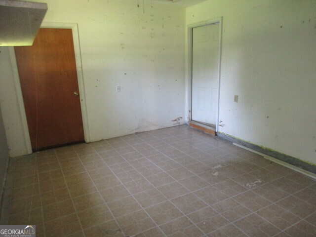 625 Strickland Road Locust Grove, GA 30248 - Photo 9 of 11 a view of an empty room