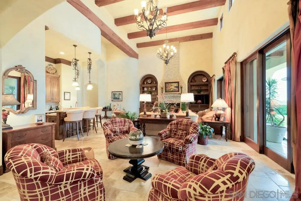 16537 Rd To Rio San Diego, CA 92127 - Photo 11 of 30 a living room with lots of furniture and paintings on the wall