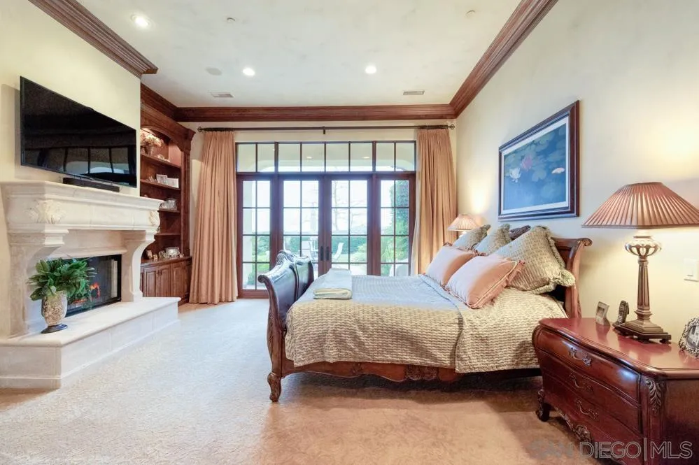 16537 Rd To Rio San Diego, CA 92127 - Photo 17 of 30 a spacious bedroom with a bed and a flat screen tv