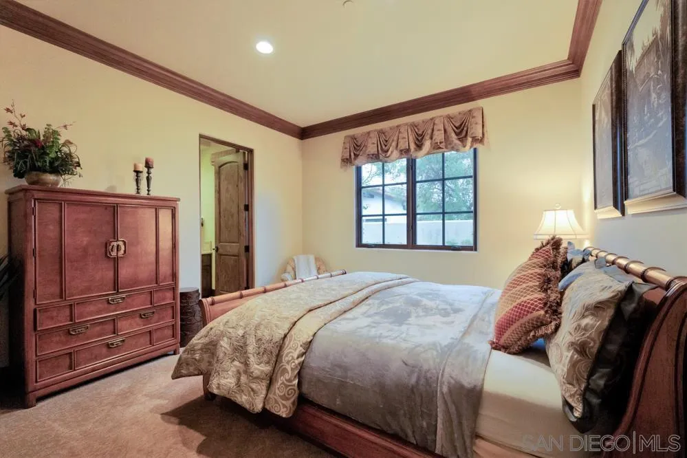 16537 Rd To Rio San Diego, CA 92127 - Photo 20 of 30 a bed sitting in a bedroom next to a window