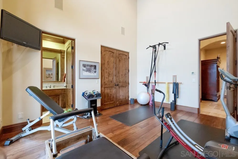 16537 Rd To Rio San Diego, CA 92127 - Photo 24 of 30 a living room with furniture a desk and wooden floor