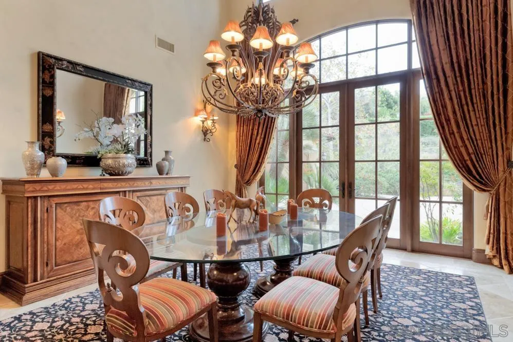 16537 Rd To Rio San Diego, CA 92127 - Photo 4 of 30 a view of a dining room with furniture wooden floor and chandelier