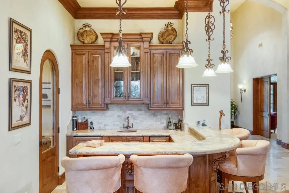 16537 Rd To Rio San Diego, CA 92127 - Photo 9 of 30 a kitchen with a refrigerator a sink and cabinets