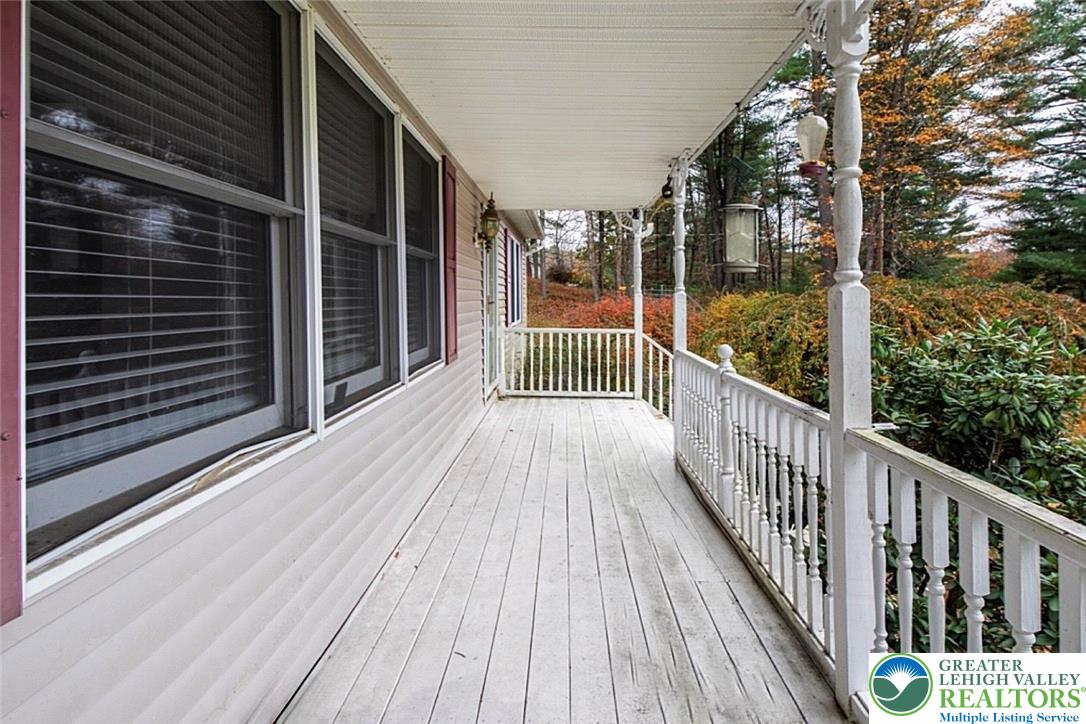 139 Johnny Bee Road Dingmans Ferry, PA 18328 - Photo 14 of 51 a view of a balcony with wooden floor