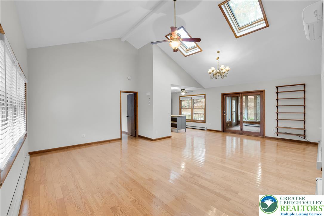 139 Johnny Bee Road Dingmans Ferry, PA 18328 - Photo 15 of 51 wooden floor in an empty room with a window