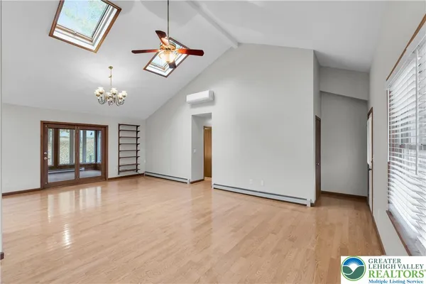 a view of an empty room with windows