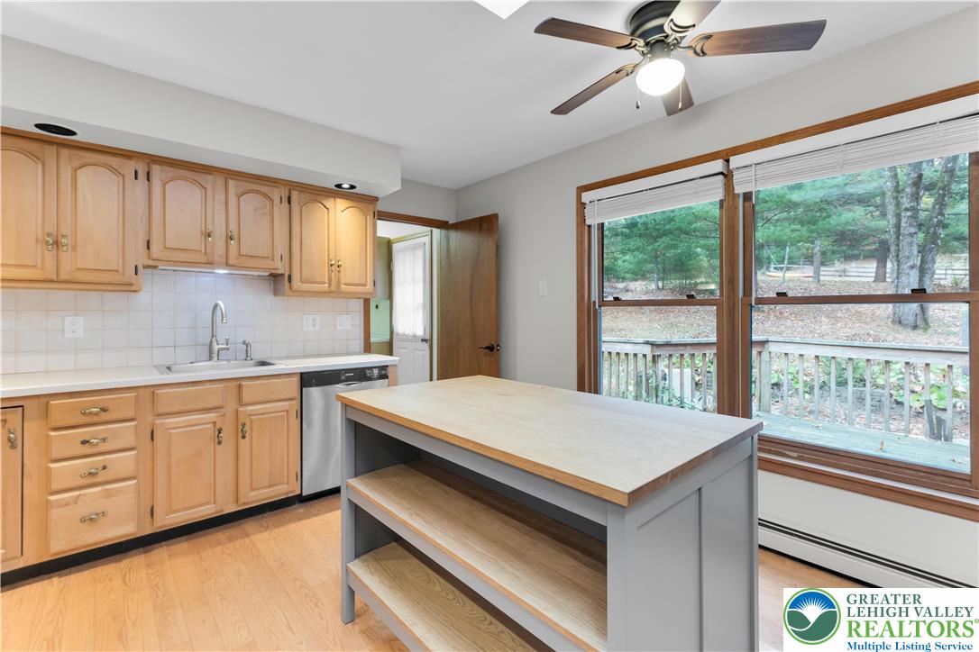 139 Johnny Bee Road Dingmans Ferry, PA 18328 - Photo 24 of 51 a kitchen with a stove a sink and a window