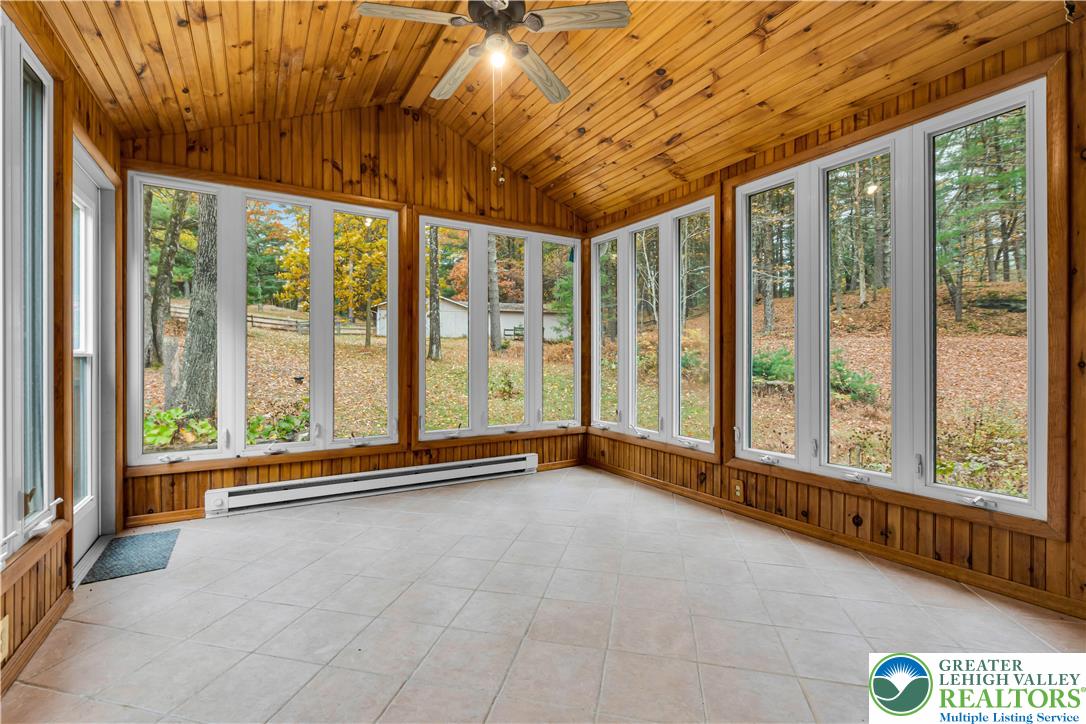 139 Johnny Bee Road Dingmans Ferry, PA 18328 - Photo 25 of 51 a view of an empty room with windows
