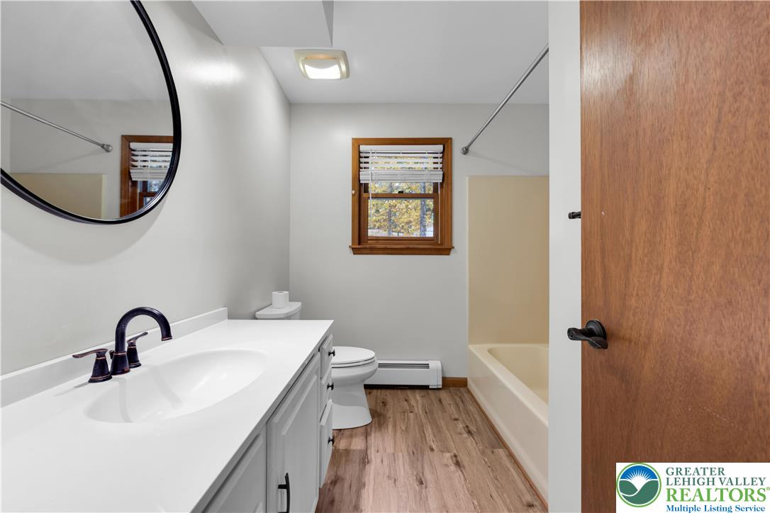 139 Johnny Bee Road Dingmans Ferry, PA 18328 - Photo 36 of 51 a bathroom with a sink and a mirror