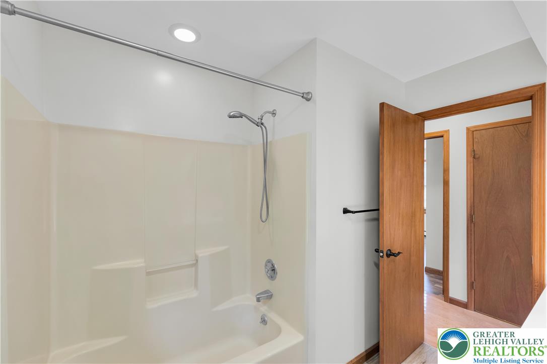 139 Johnny Bee Road Dingmans Ferry, PA 18328 - Photo 37 of 51 a bathroom with a shower and a tub