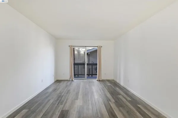 a view of wooden floor in an empty room