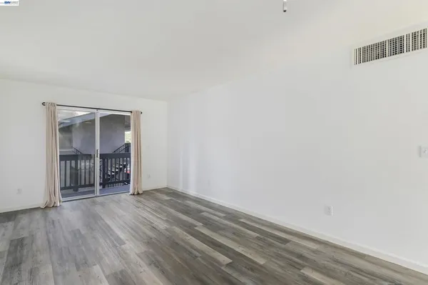 a view of a livingroom with wooden floor