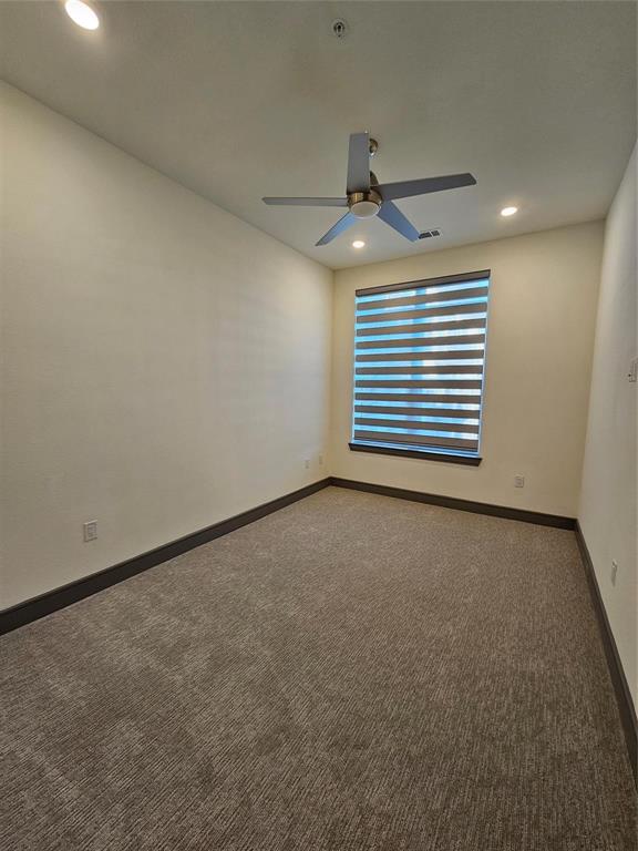 2700 Old Denton Road, Unit 3325 Carrollton, TX 75007 - Photo 3 of 6 Carpeted room featuring a ceiling fan with integrated lighting, recessed ceiling lights, a window with horizontal blinds, and dark baseboards