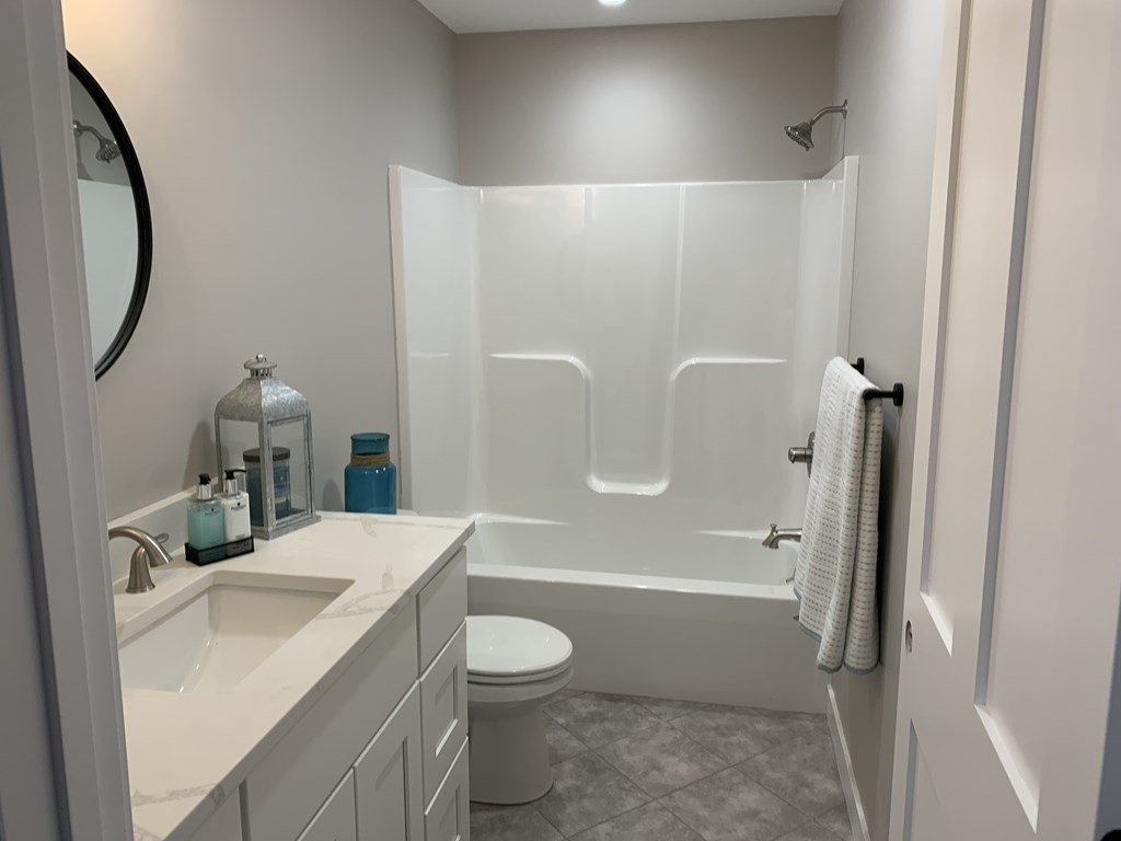 18 White Loaf Road Southampton, MA 01073 - Photo 16 of 20 a bathroom with a sink a toilet and shower