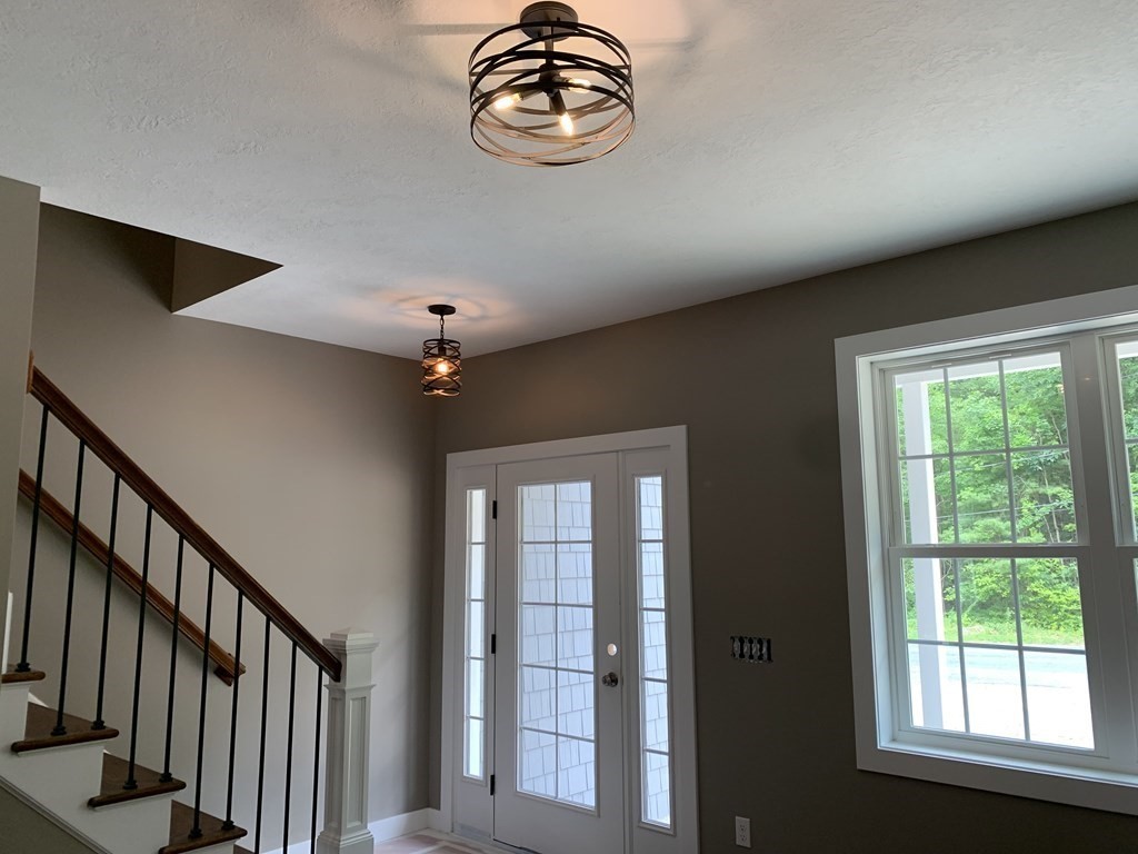 18 White Loaf Road Southampton, MA 01073 - Photo 8 of 20 a very nice looking room with a large window and chandelier
