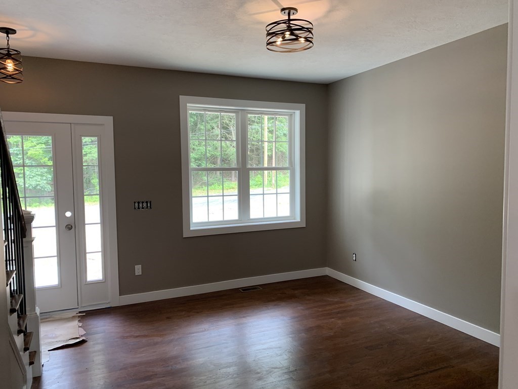 18 White Loaf Road Southampton, MA 01073 - Photo 9 of 20 a view of an empty room with wooden floor and a window