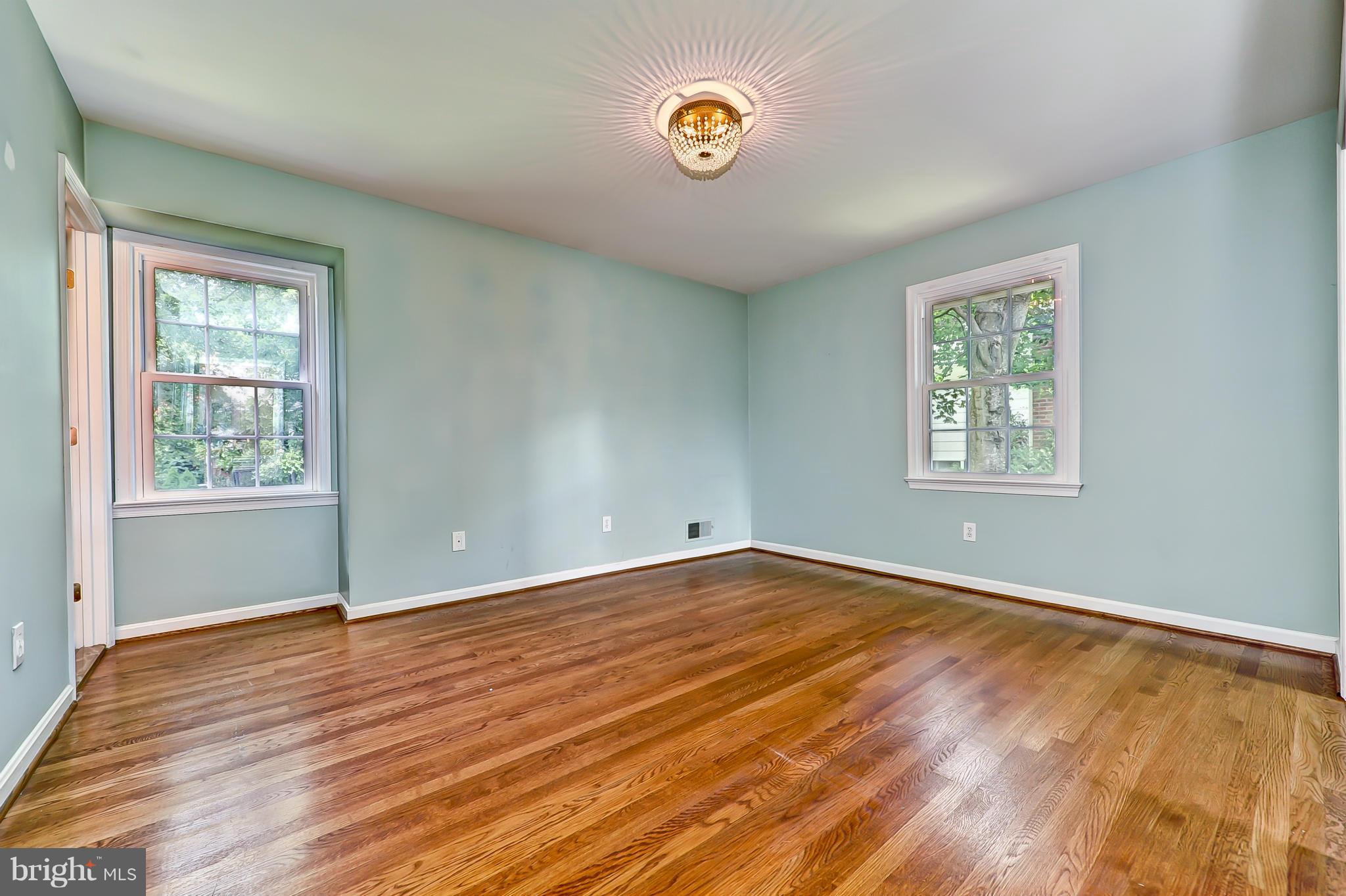 8417 Riverside Road Alexandria, VA 22308 - Photo 16 of 30 a view of an empty room with wooden floor and a window