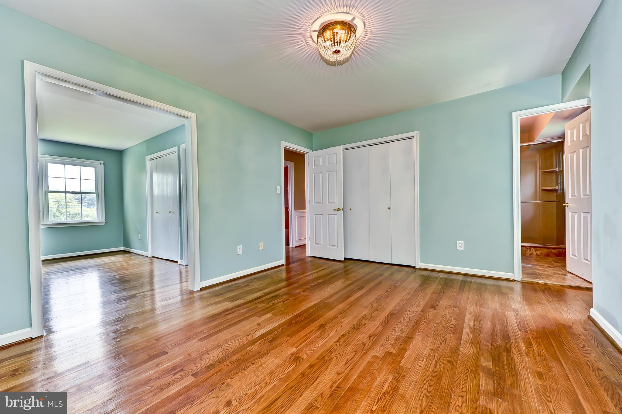 8417 Riverside Road Alexandria, VA 22308 - Photo 18 of 30 an empty room with wooden floor and windows