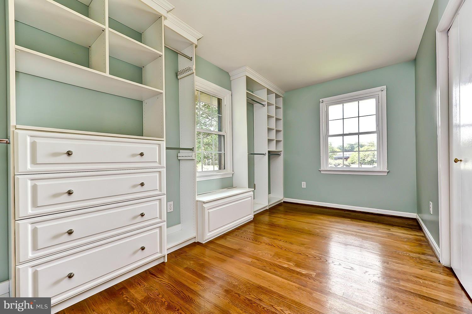 8417 Riverside Road Alexandria, VA 22308 - Photo 19 of 30 a view of a bedroom with wooden floor and cabinet