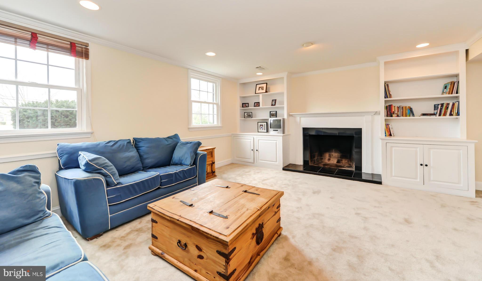 8417 Riverside Road Alexandria, VA 22308 - Photo 20 of 30 a living room with furniture a window and a fireplace