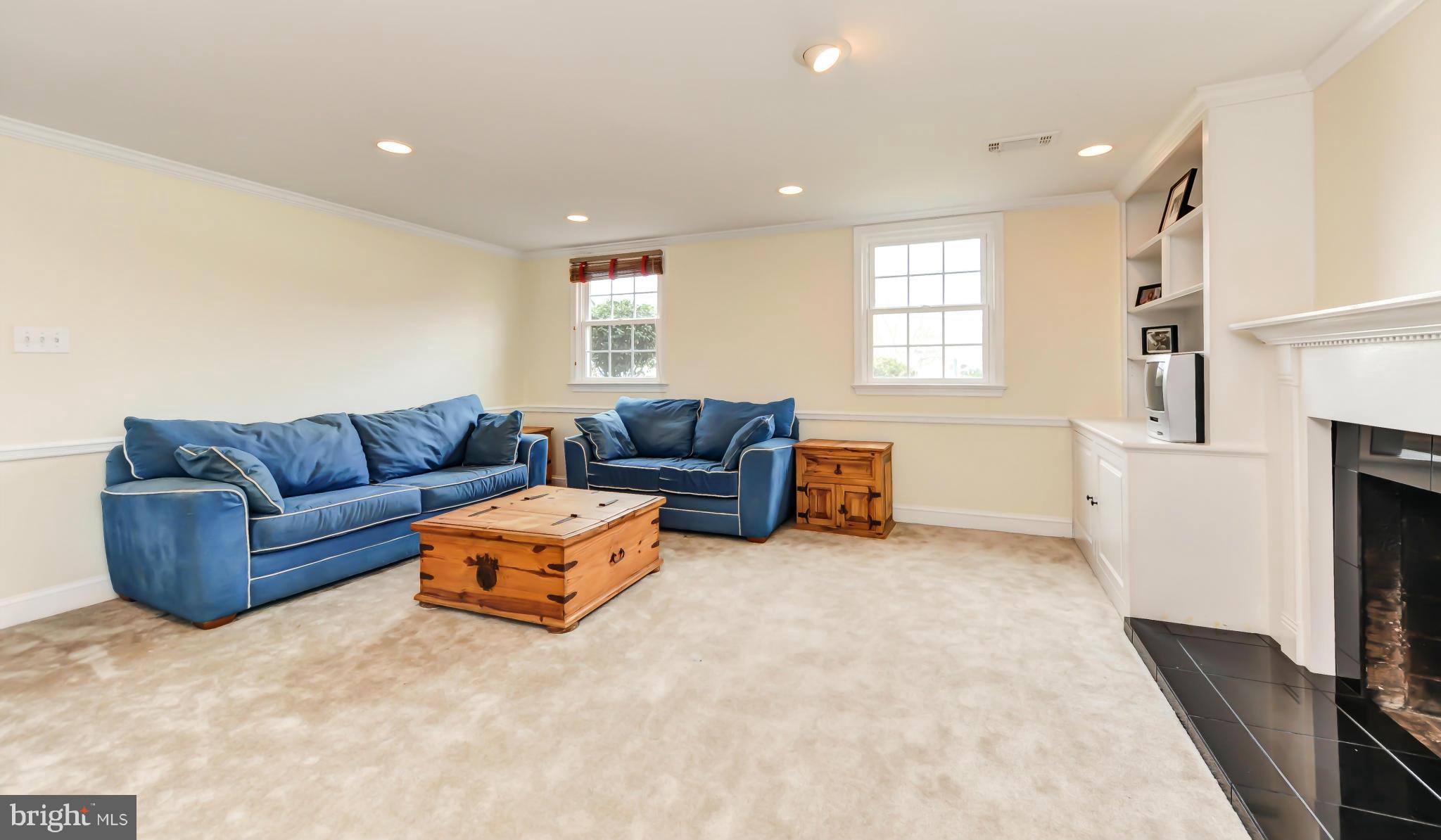 8417 Riverside Road Alexandria, VA 22308 - Photo 21 of 30 a living room with furniture window and a flat screen tv
