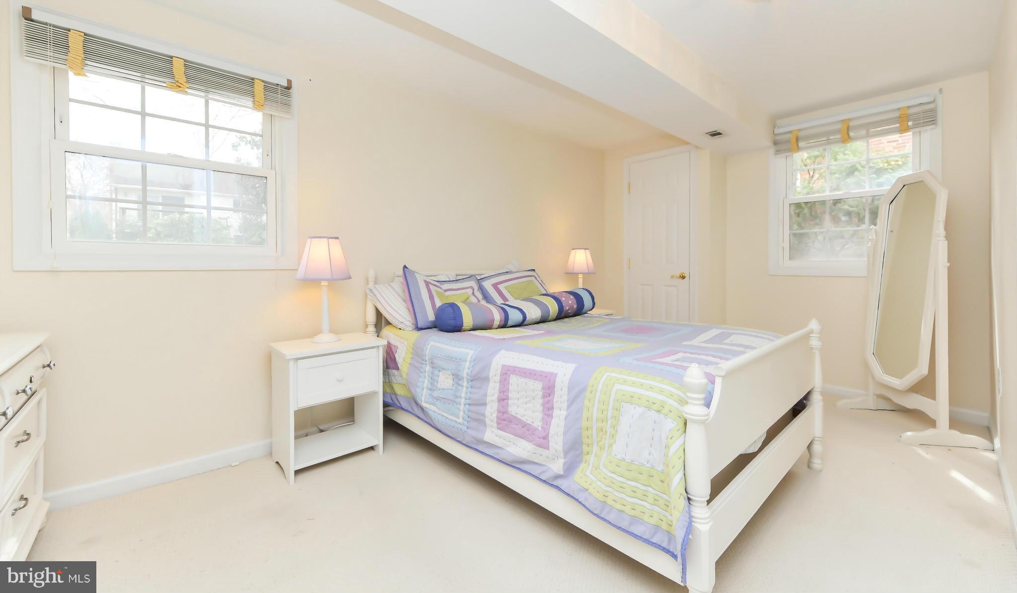 8417 Riverside Road Alexandria, VA 22308 - Photo 25 of 30 a bedroom with a bed and window