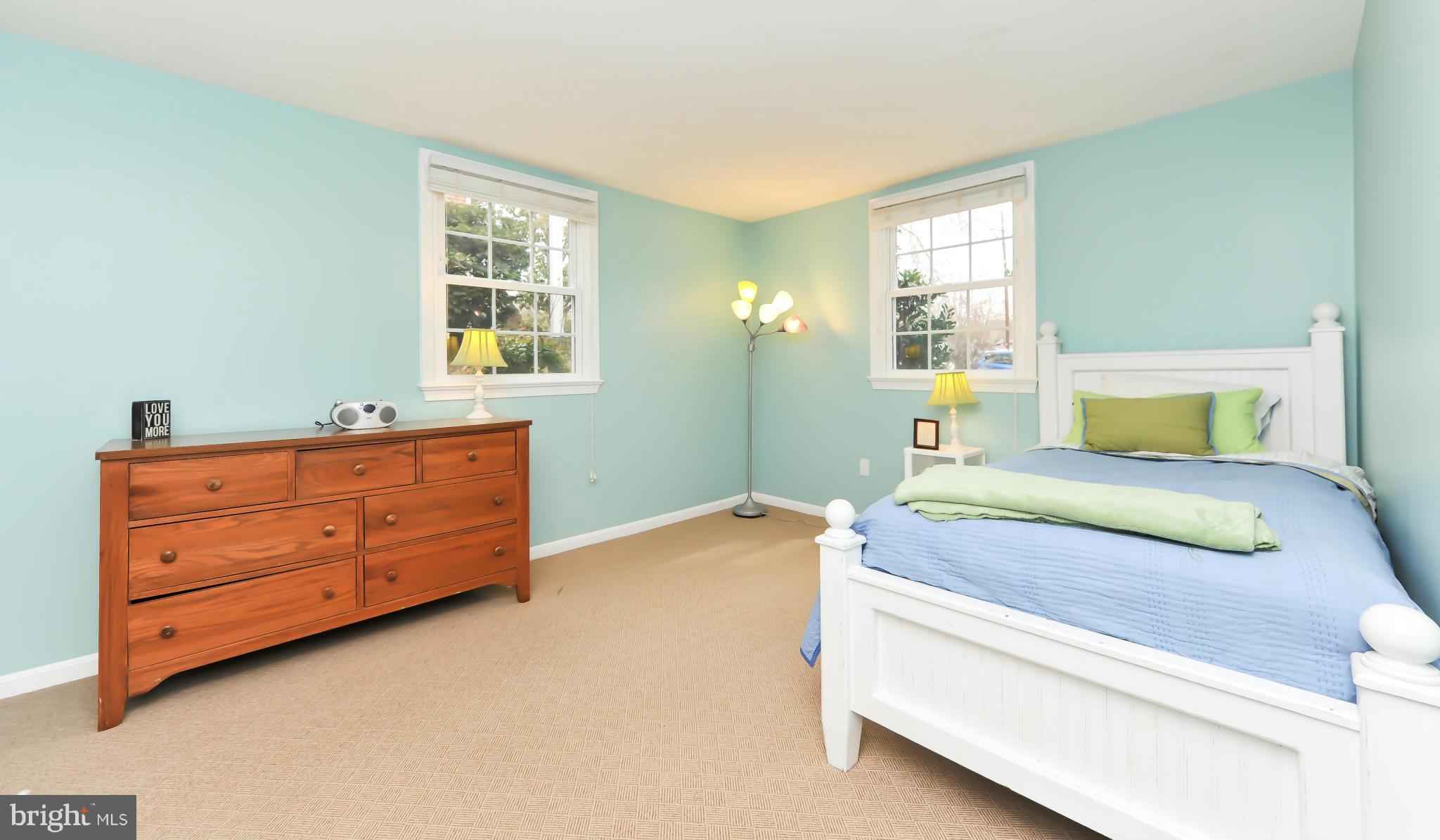 8417 Riverside Road Alexandria, VA 22308 - Photo 27 of 30 a bedroom with a bed and a dresser