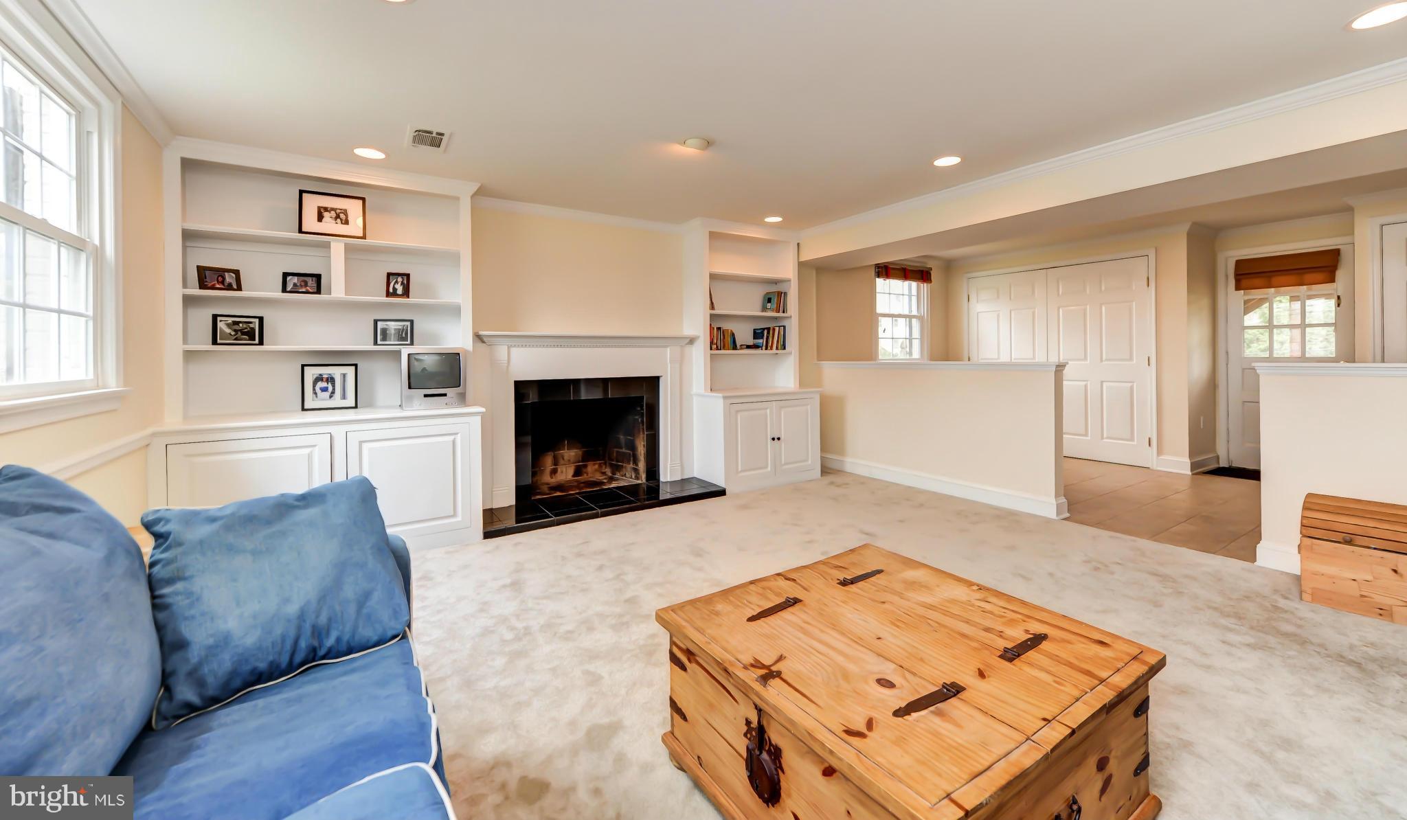 8417 Riverside Road Alexandria, VA 22308 - Photo 4 of 30 a living room with furniture and a fireplace