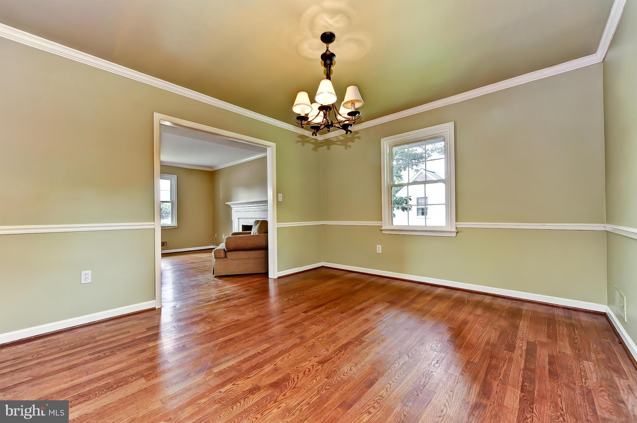 8417 Riverside Road Alexandria, VA 22308 - Photo 10 of 30 a view of an empty room with window and wooden floor