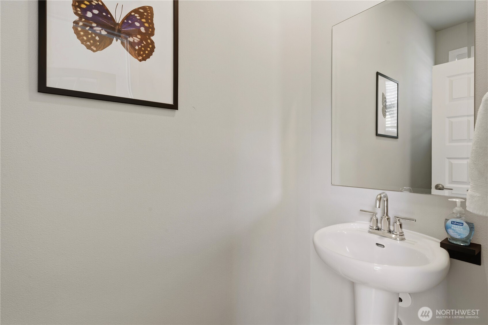 19432 9th Avenue Southeast Bothell, WA 98012 - Photo 28 of 33 a bathroom with a sink and a mirror