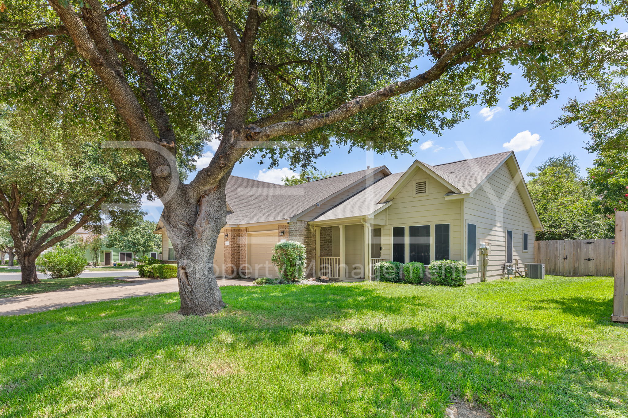 103 Prairie Springs Loop Georgetown, TX 78626 - Photo 6 of 33 Mature trees canopy this inviting home, enhancing its curb appeal.