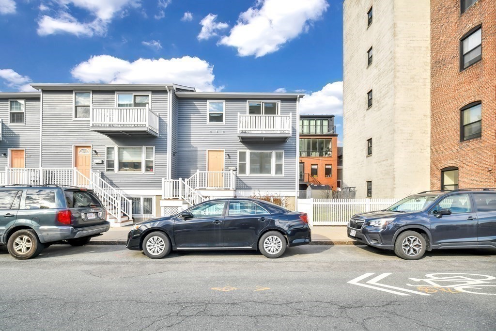 68 Marginal Street, Unit A Boston, MA 02128 - Photo 2 of 21 a car parked in front of a building