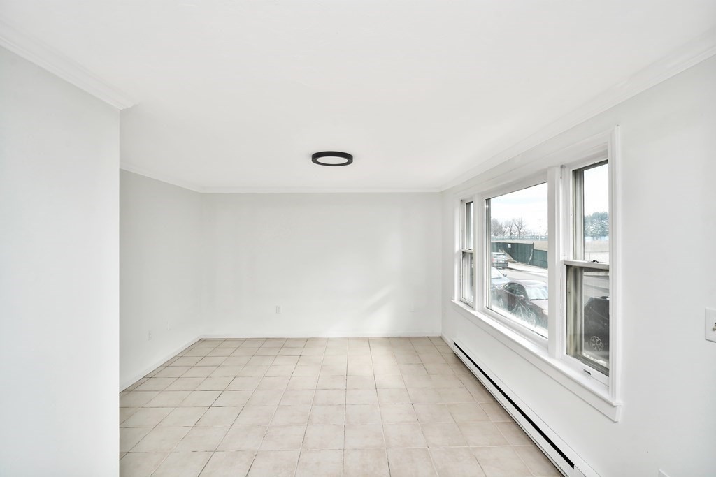 68 Marginal Street, Unit A Boston, MA 02128 - Photo 6 of 21 a view of an empty room with a window