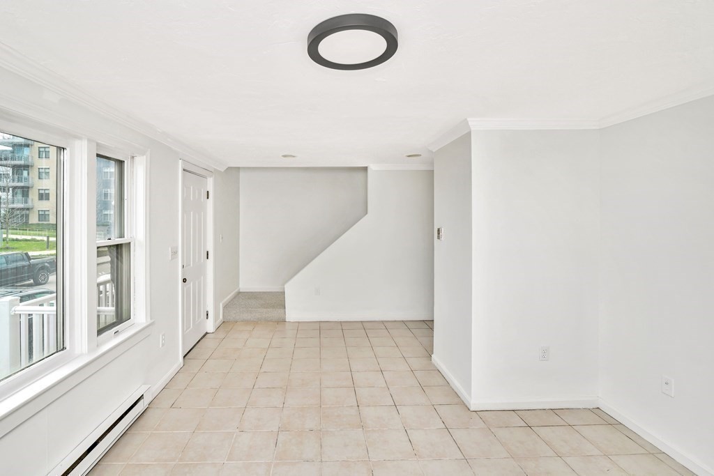 68 Marginal Street, Unit A Boston, MA 02128 - Photo 7 of 21 a view of a room with wooden floor and entryway