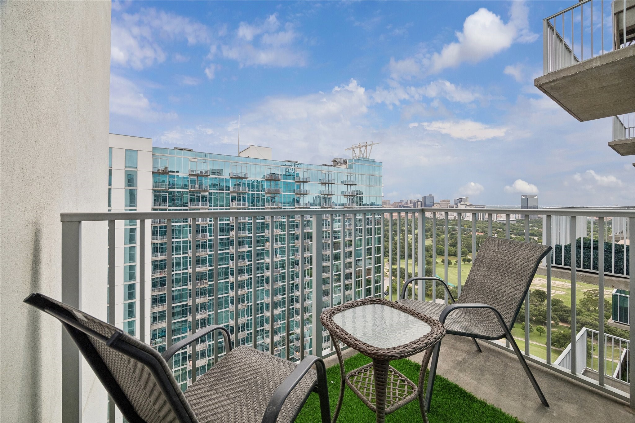 5925 Almeda Road, Unit 12704 Houston, TX 77004 - Photo 10 of 31 Step outside onto your private balcony and enjoy stunning views stretching across Hermann Park and the surrounding skyline. An ideal setting for morning coffee, evening sunsets, or simply taking in the scenery.