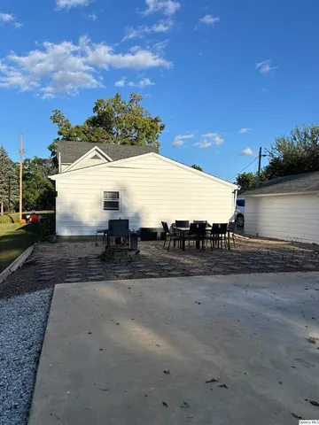a view of outdoor space with table and chairs