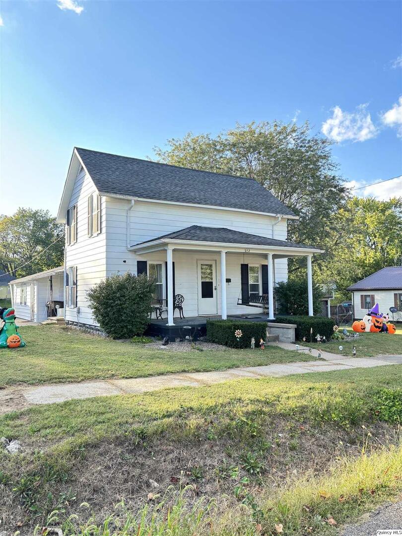 212 South 1st Street Carthage, IL 62321 - Photo 2 of 17 a view of house with outdoor space and swimming pool