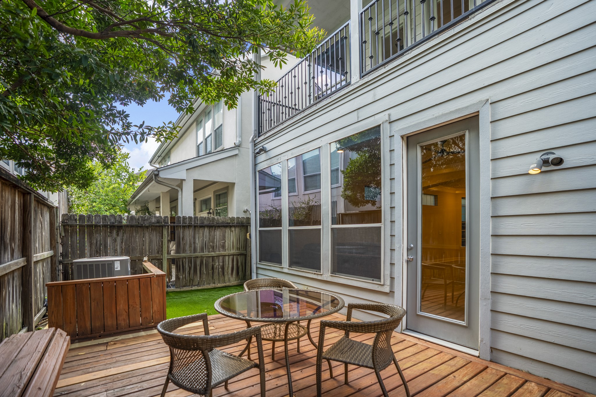 4236 Drake Street Houston, TX 77005 - Photo 2 of 43 Out back, you have a private, low-maintenance oasis. Complete with a wood deck and premium turf, it is the absolute perfect backdrop for weekend barbecues and seamless entertaining without the hassle of yard work.